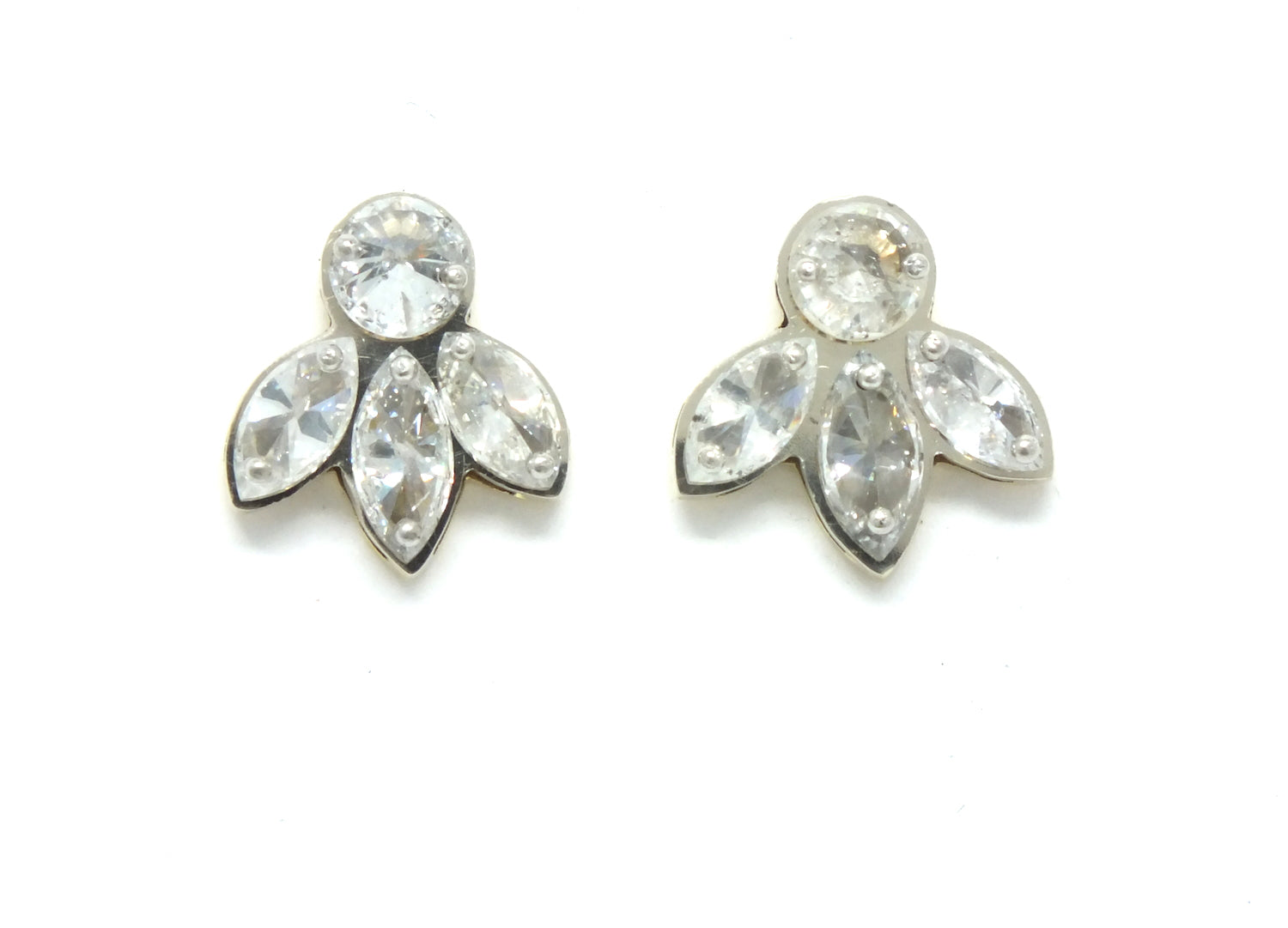 One Round Diamond with Three Marquise Diamond Studs